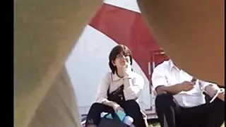 Busty woman fucks her girl with a strap-on and makes her cum